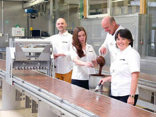 The long chocolate sheets are cut into bars