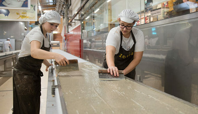 A thin chocolate layer is brushed onto the entire track