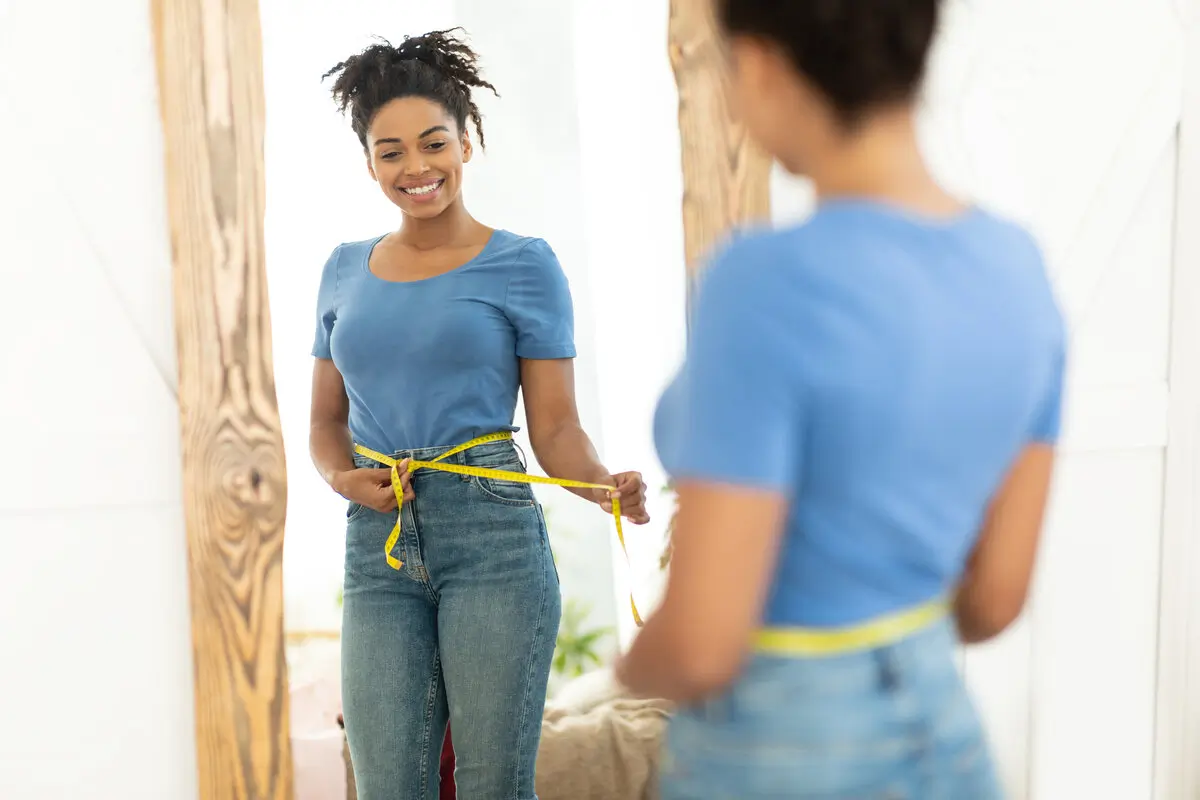 Here's Why Dark Chocolate Should Be Part of Your Weight Loss Plan 8 Happy Black Girl After Weight Loss Measuring Waist At Home