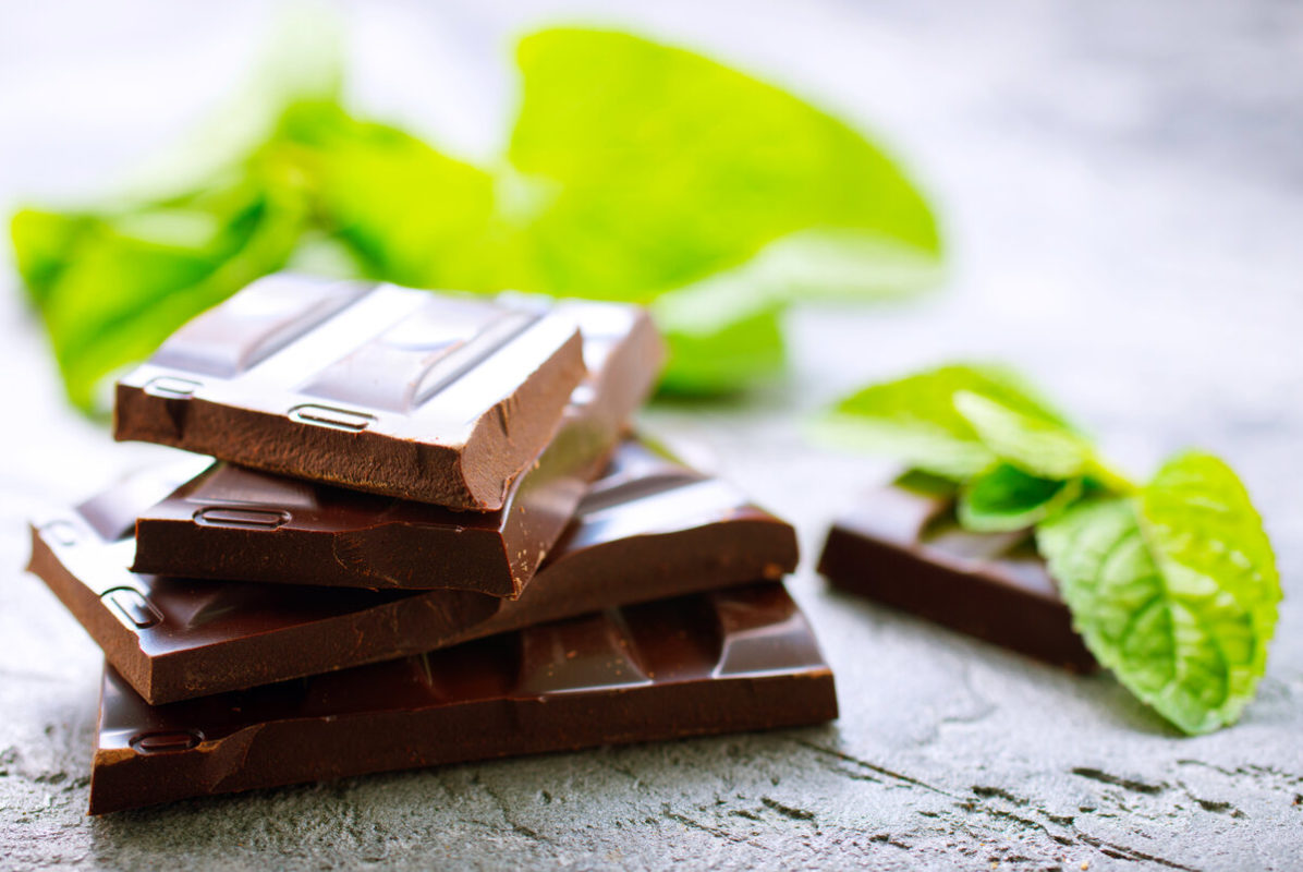 organic chocolate and mint leaf on a table