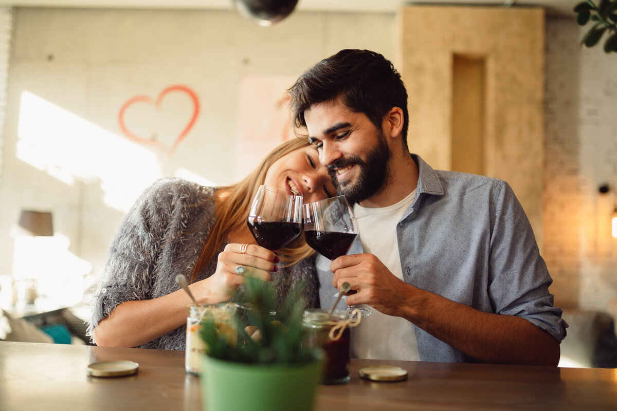 Which Wines Pair Best With Chocolate? 5 Cheers! Happy couple is drinking wine at cafe during a day