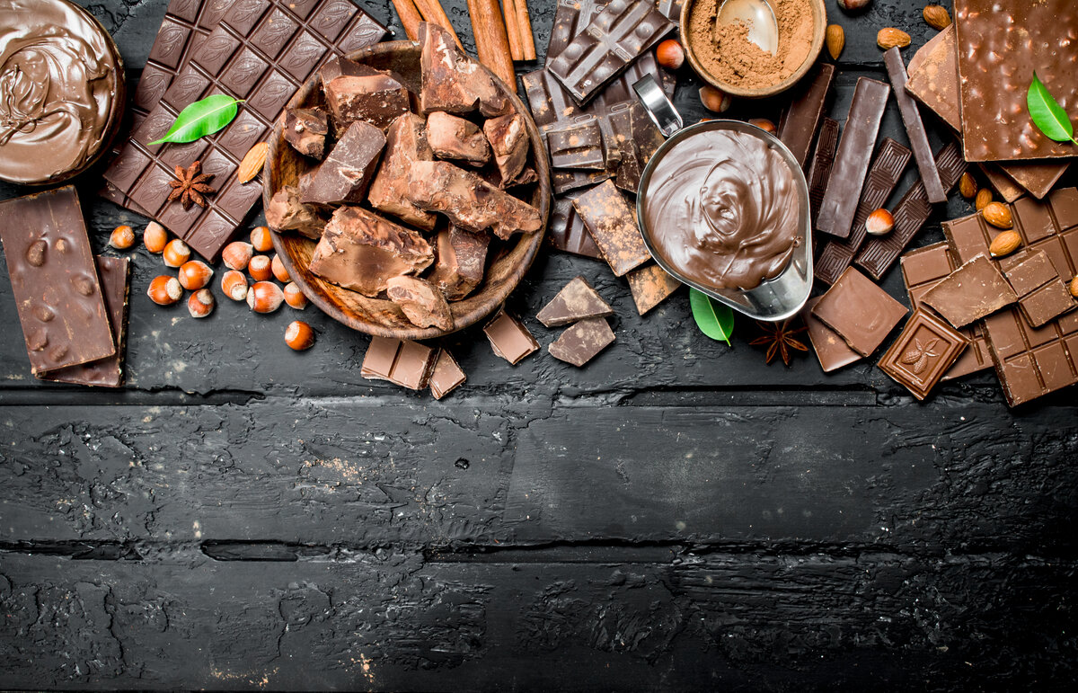 Tips for Creating a Dessert Charcuterie With Chocolate 4 Chocolate background. Various assortment of chocolate with paste.