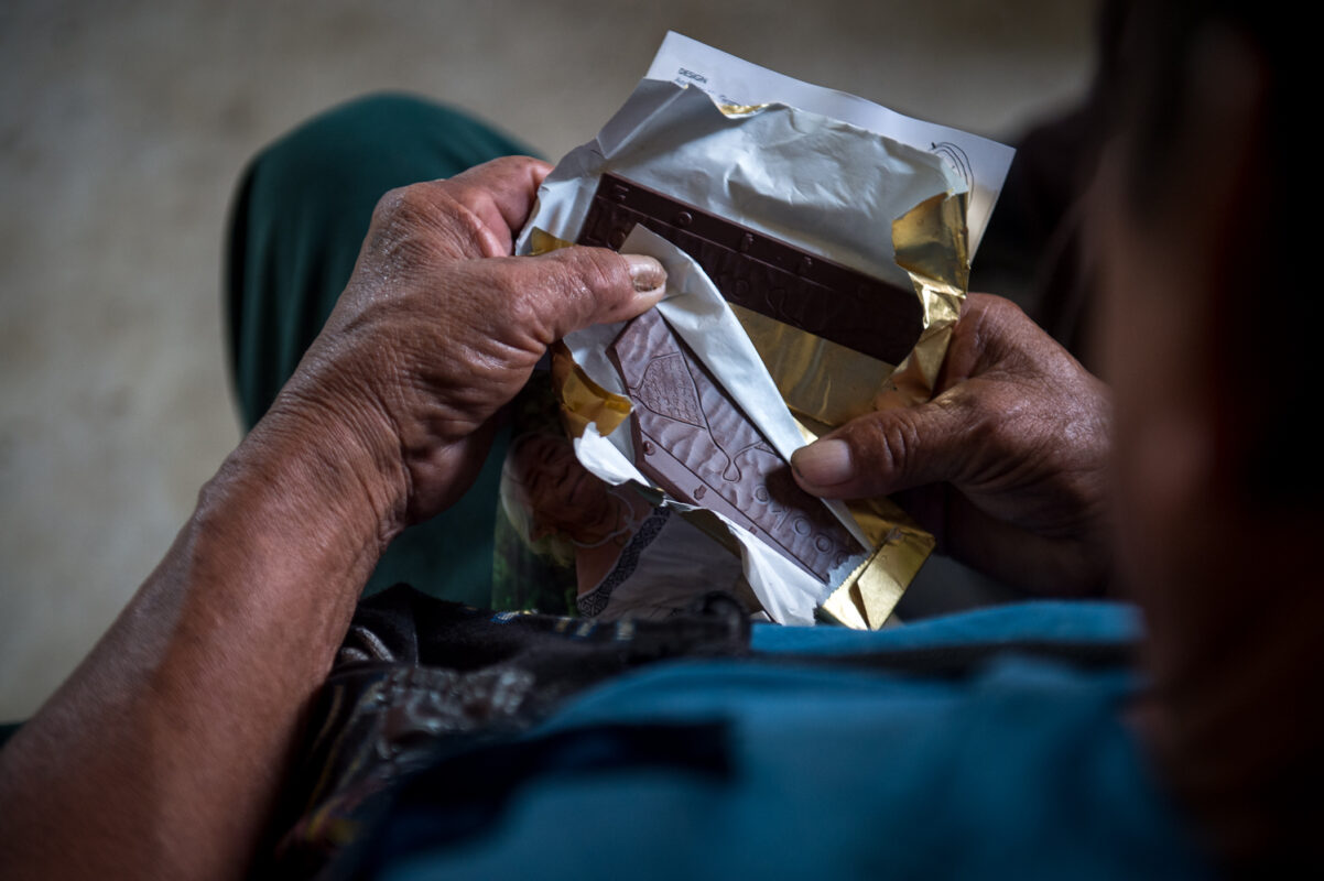 Farmer holding chocolate bar