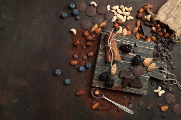 Chocolate and other ingredients scattered on a wooden table